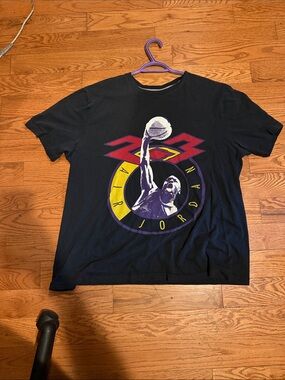 Nike Air Jordan Black Short-Sleeve Graphic Tee with Purple and Yellow Accents